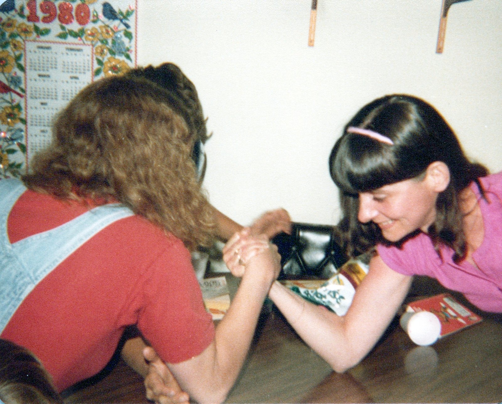Two people arm wrestling